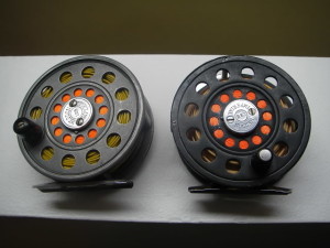 From 1924 to 1949, the Heddon company offered the 125 Imperial, an attractive 3 1/4" trout reel that looks great on vintage rods. The rod on the left is an early gray model with an agate circular line guard. The model on the right is the final version, painted black and with an adjustable drag and a rolling pillar line guard.