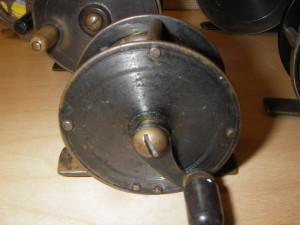 An Allcock & Sons Brass reel from 1870s Britain.